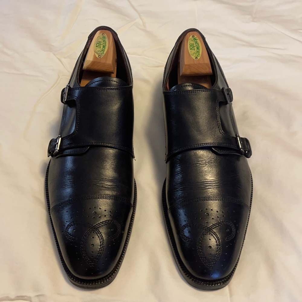 Black Double monk-strap shoe with brogue details.